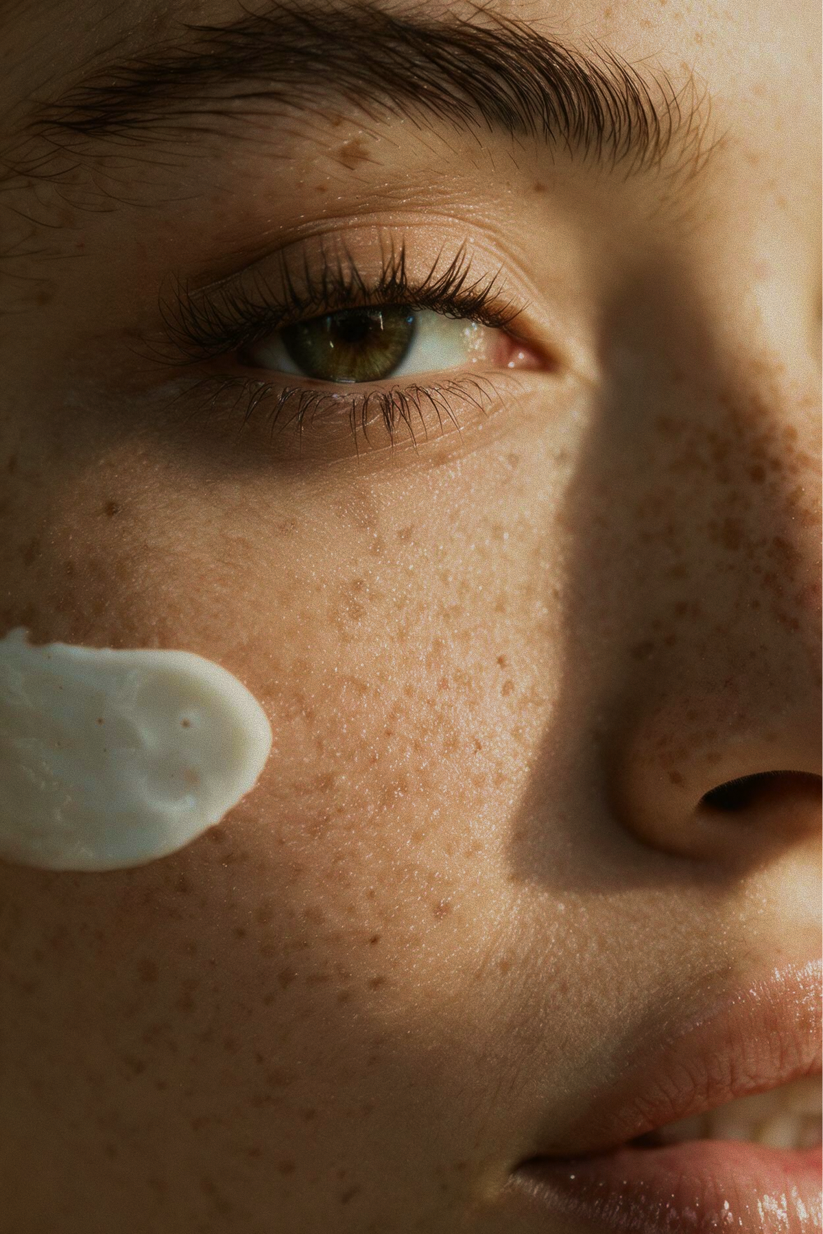 Close-up of skincare cream applied to the cheek during the Full Edit facial at Skincuress in Hoboken, NJ