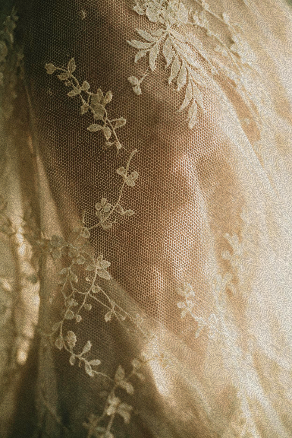 Sheer beige floral lace fabric, capturing the elegant spa ambiance of the Signature Skincuress Facial in Hoboken, NJ